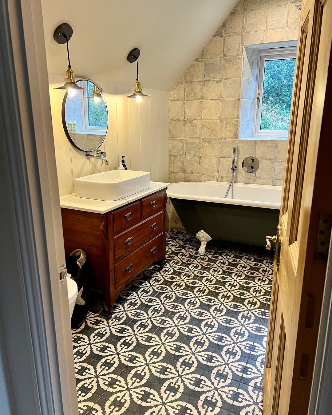 Bathroom finished by Safeway Electrician, with new pendant lights glowing above the sink